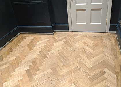 The new oak parquet floor in the cloakroom